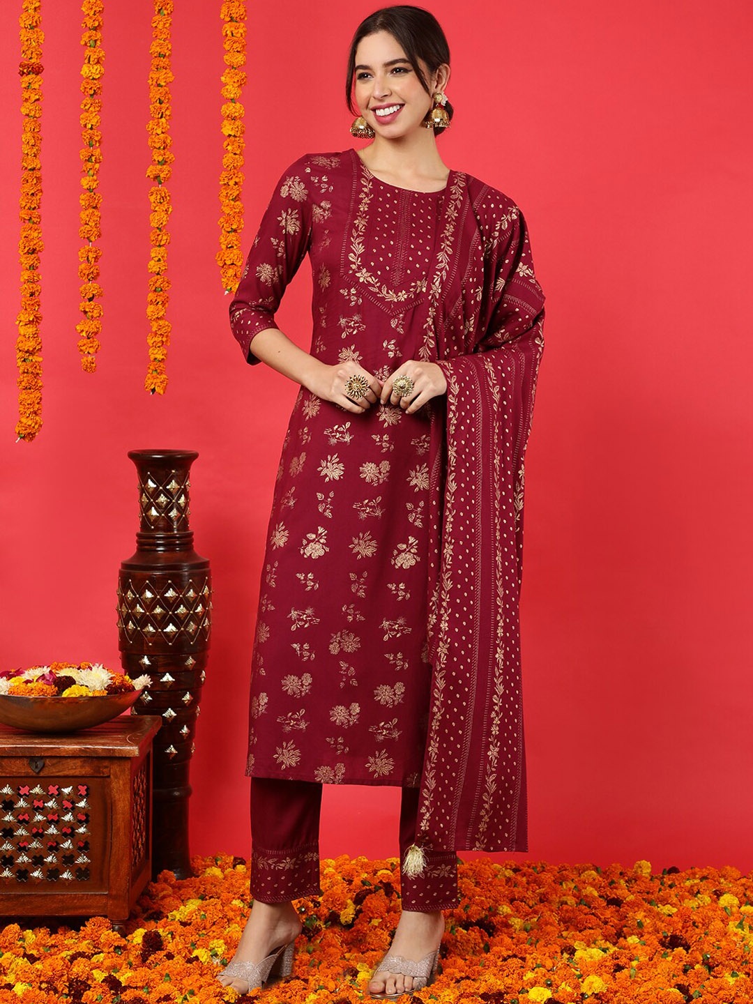 

KIMAYRA Printed Regular Kurta with Trousers & With Dupatta, Maroon