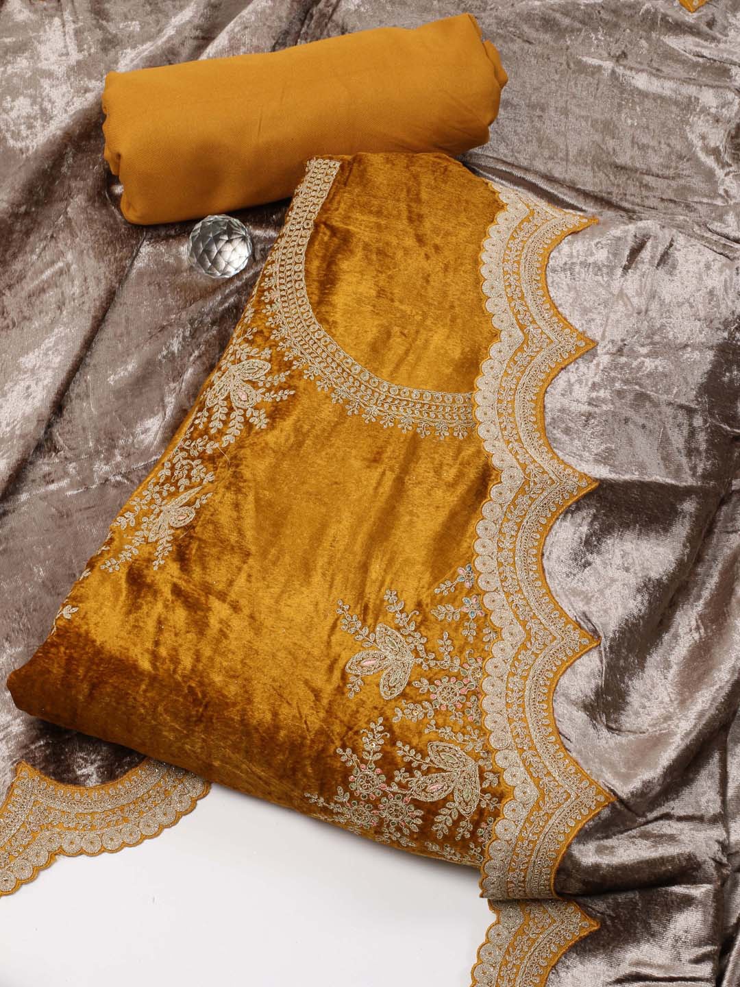 

Meena Bazaar Mustard Embroidered Velvet Unstitched Dress Material