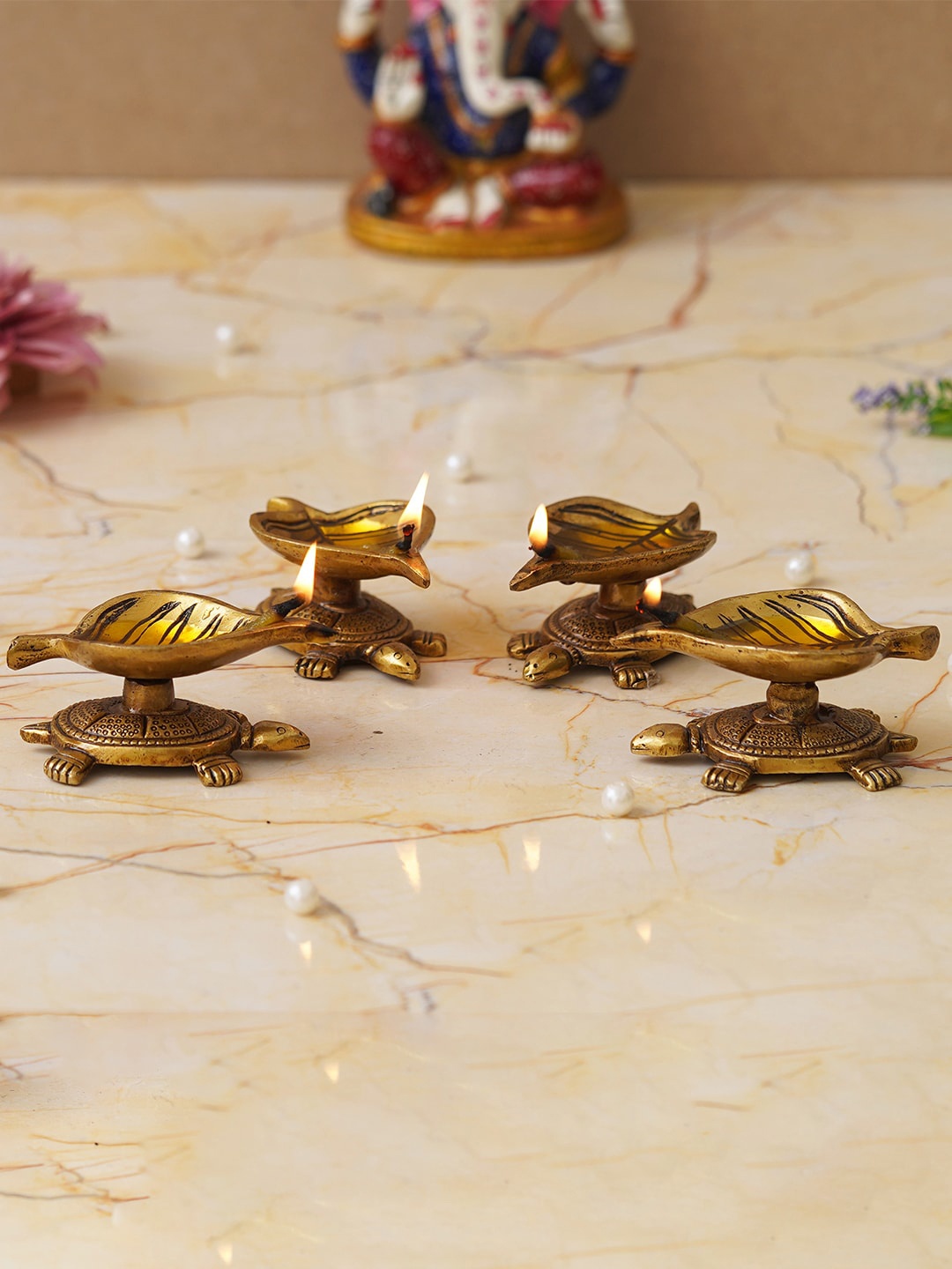 

eCraftIndia 4 Pieces Beige Tortoise Statue Leaf Design Diyas