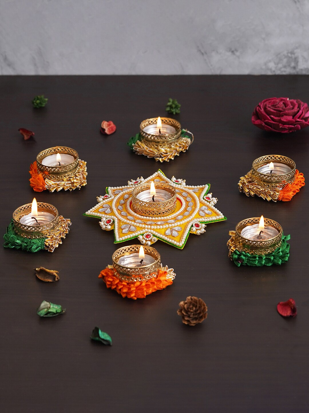 

eCraftIndia Gold Toned 8 Pieces Round & Star Shaped Decorative Tea Light Candle Holders, Yellow