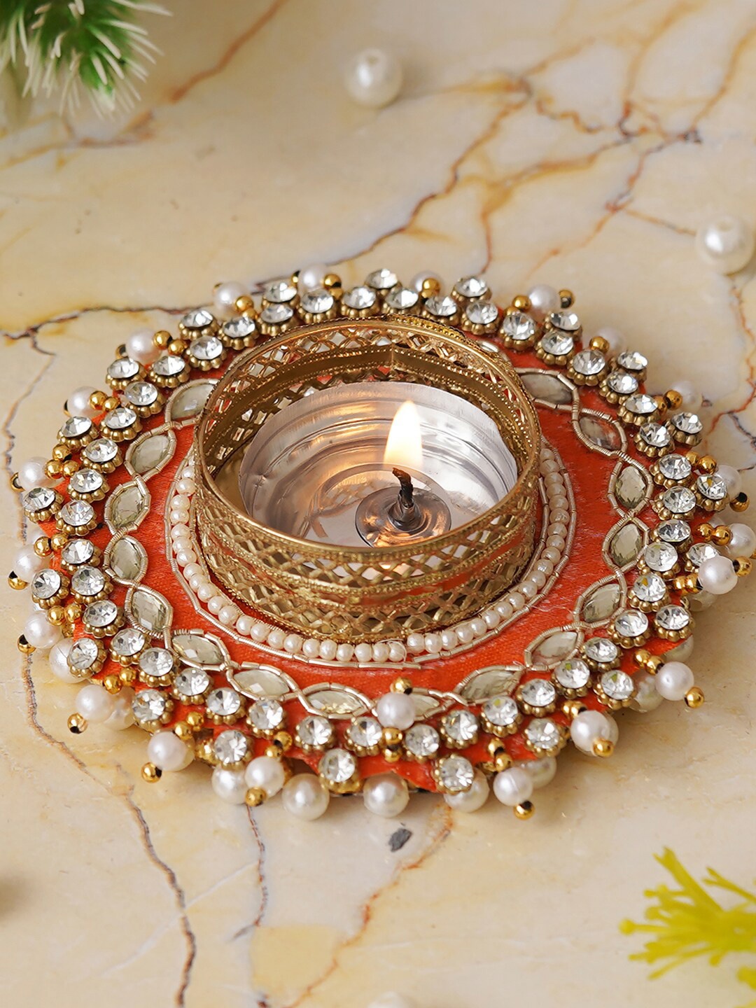 

eCraftIndia Orange & Gold Toned Round Shaped Candle Holder