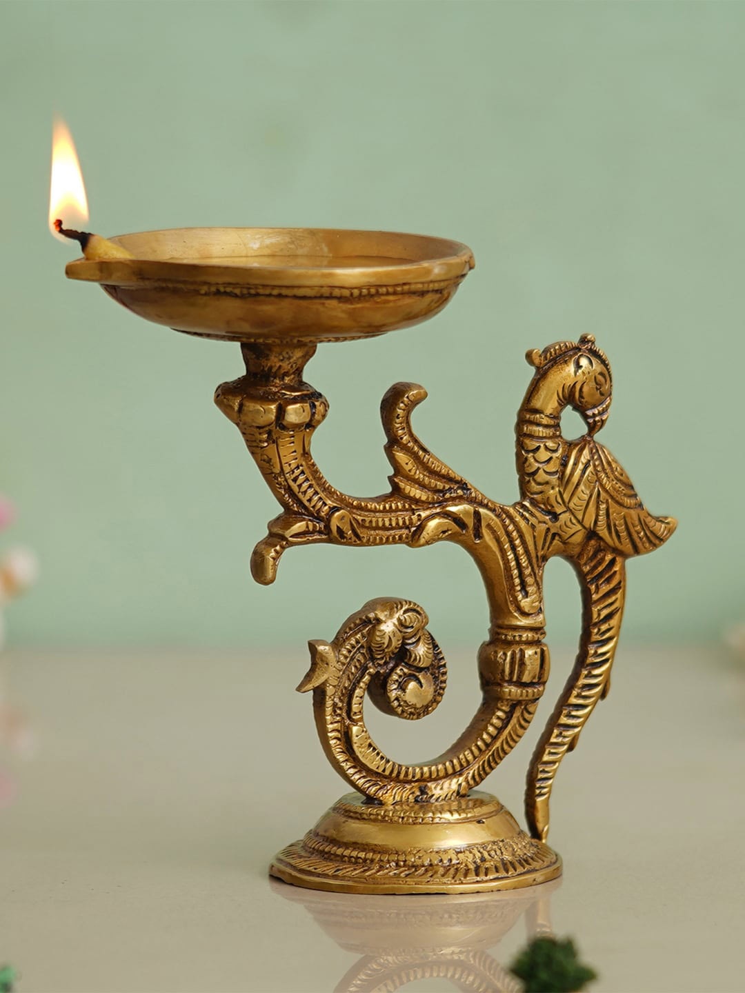 

eCraftIndia Beige Peacock Design Diyas