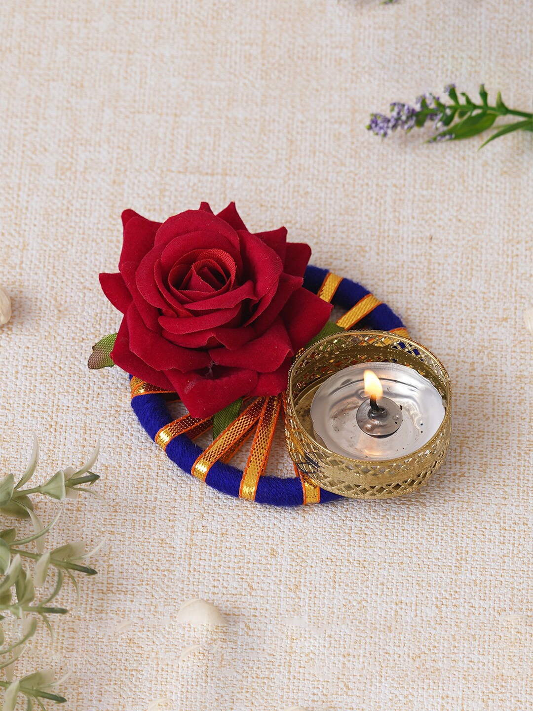 

eCraftIndia Gold Toned & Blue Round Shaped Candle Holder