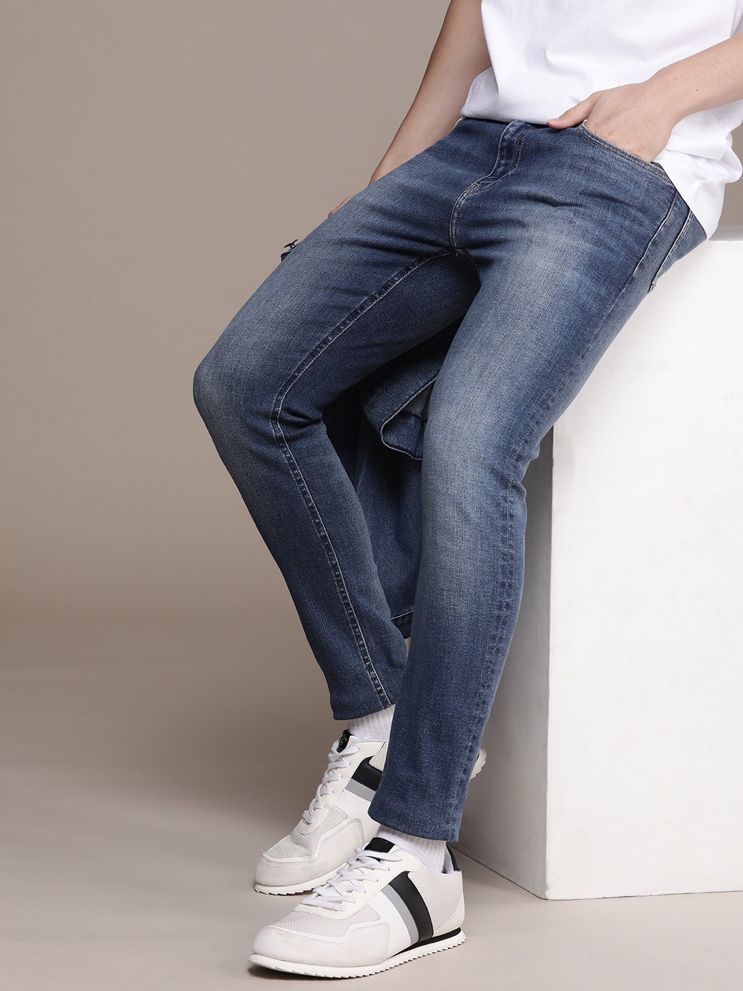 

Calvin Klein Jeans Men Super Skinny Fit Heavy Fade Stretchable Jeans, Blue