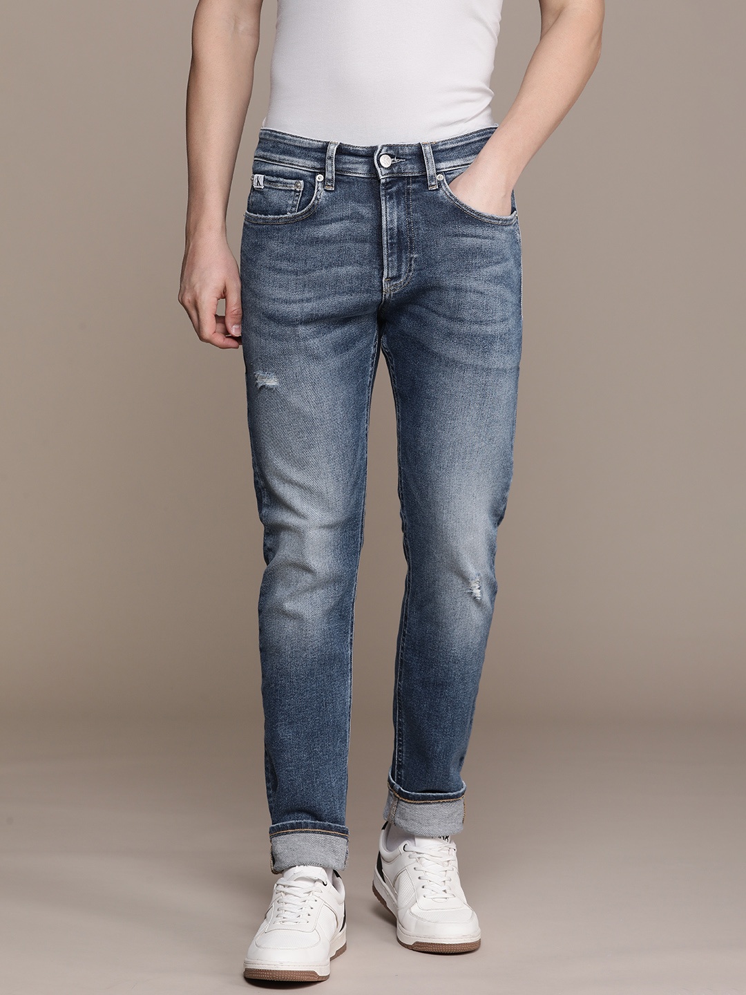 

Calvin Klein Jeans Men Skinny Fit Low Distress Heavy Fade Stretchable Mid-rise Jeans, Blue