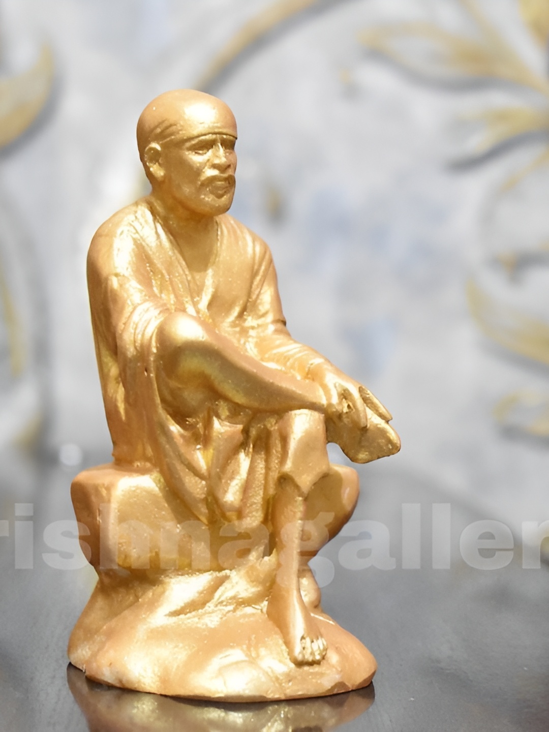 

krishnagallery1 Gold Toned Marble Sai Baba Showpiece