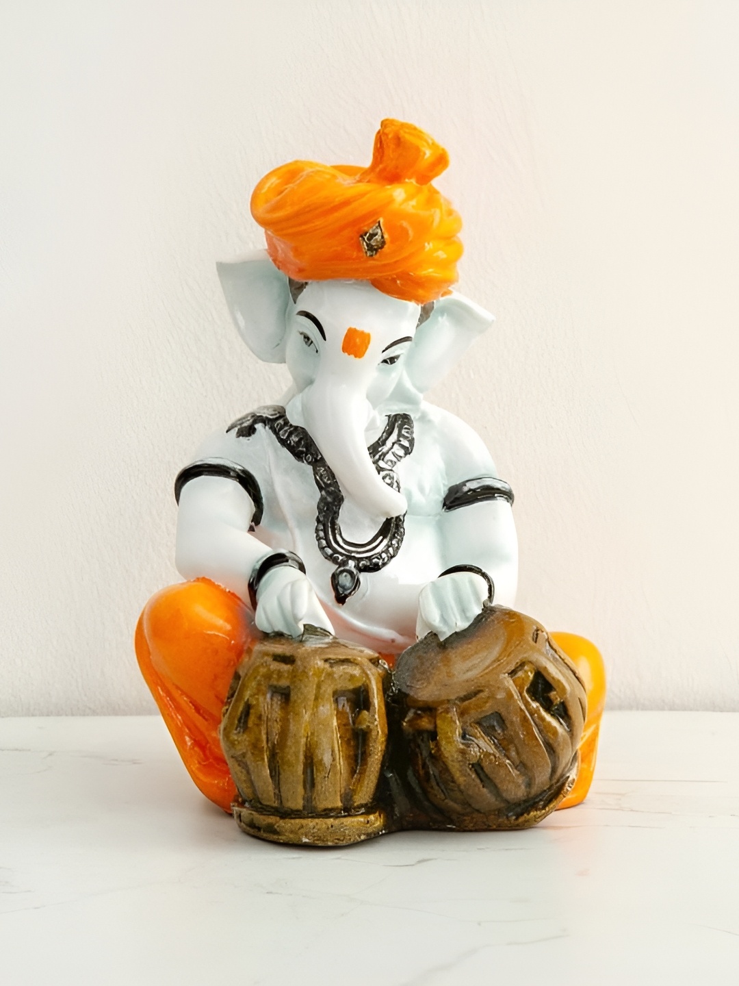 

krishnagallery1 White & Orange Tabla Ganesh Murti Marble Statue Showpiece