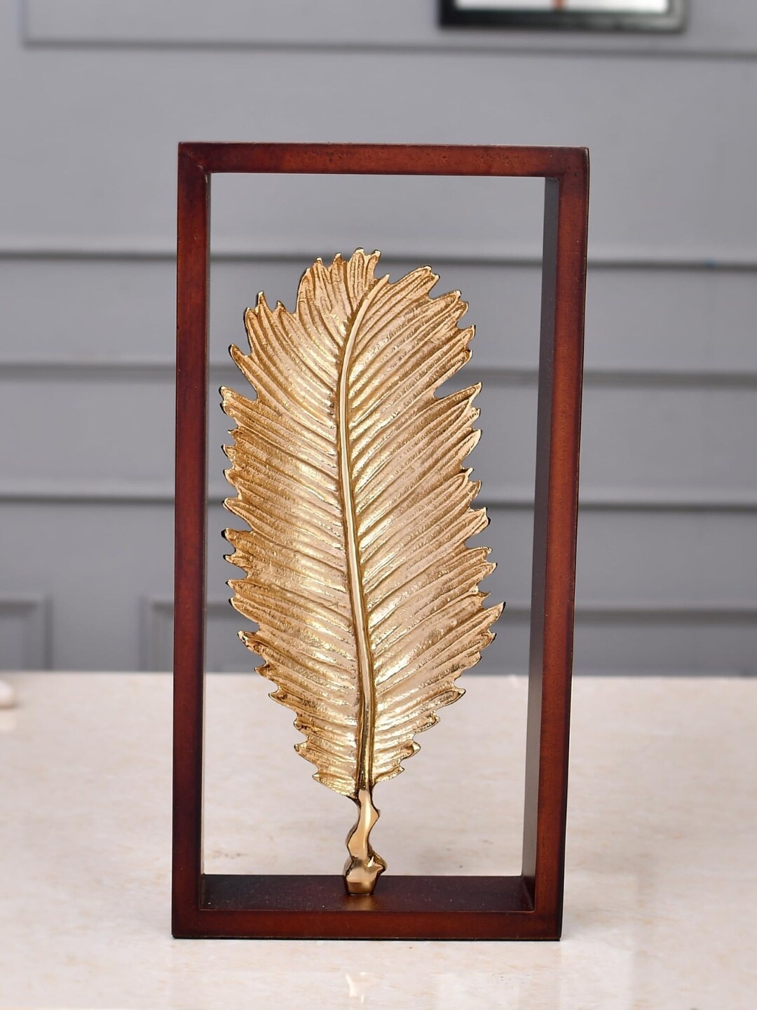 

CraftVatika Brown & Gold-Toned Small Figurine Metal Palm Leaf Showpiece