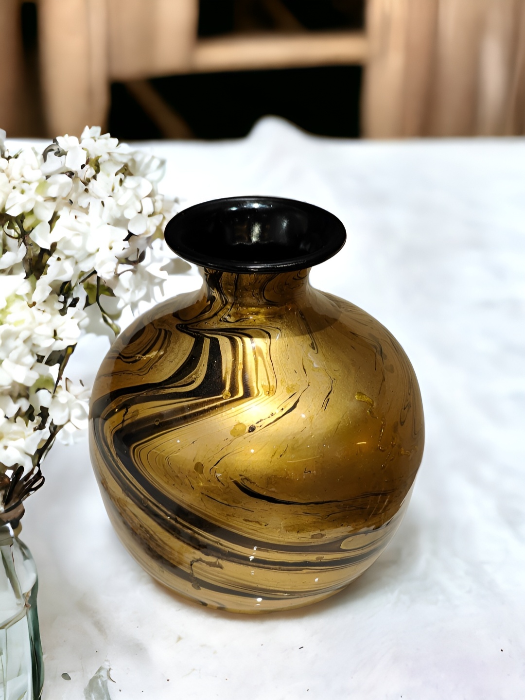

The Artage Beige Marble Finish Round Shape Metal Vase