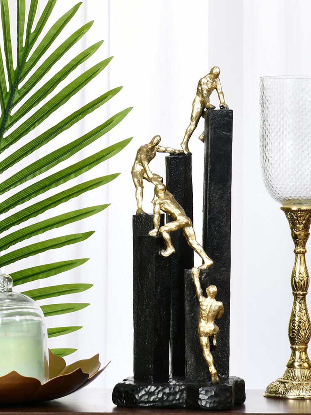 

Athome by Nilkamal Black & Gold Team Climbing On Block Decorative Showpiece