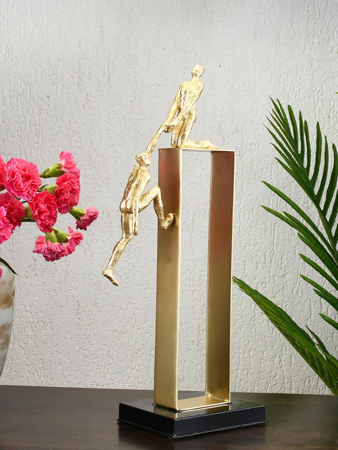 

Athome by Nilkamal Black & Gold Man Pulling Teammate Decorative Showpiece