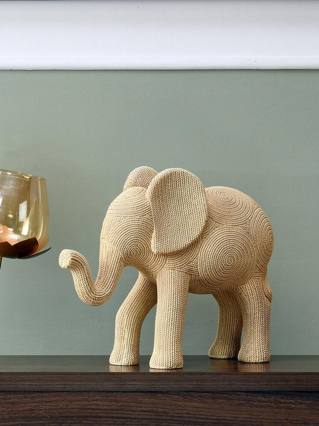

Athome by Nilkamal Cream Elephant Decorative Showpiece