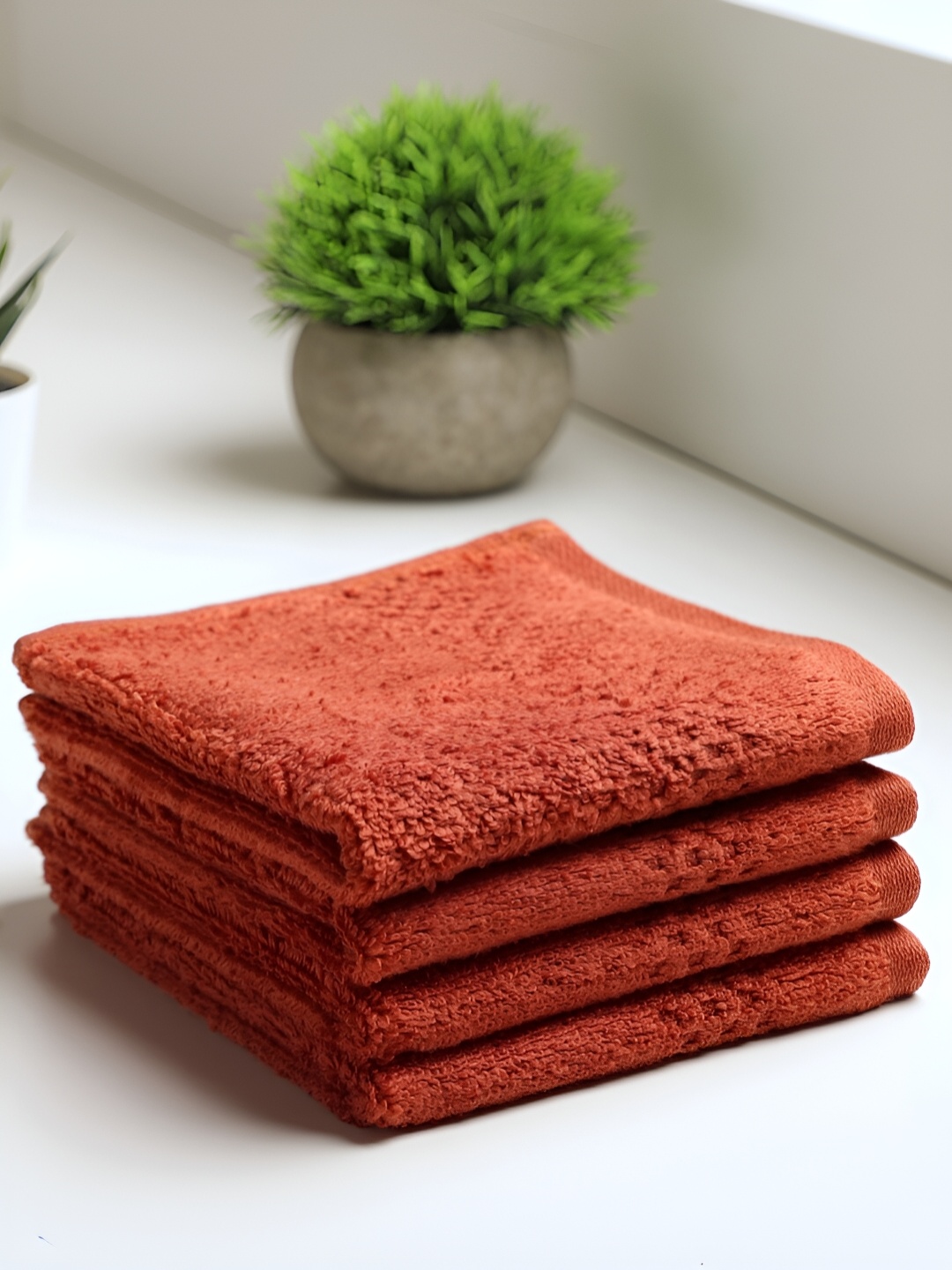 

SPACES Swift Dry Orange 4 Pieces Pure Cotton Face Towels, Rust