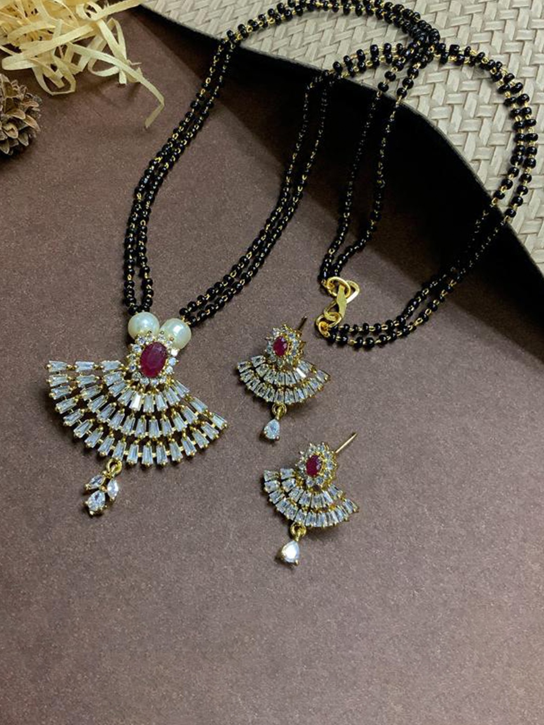 

ABDESIGNS Gold-Plated Stone-Studded & Black Beaded Mangalsutra With Earrings