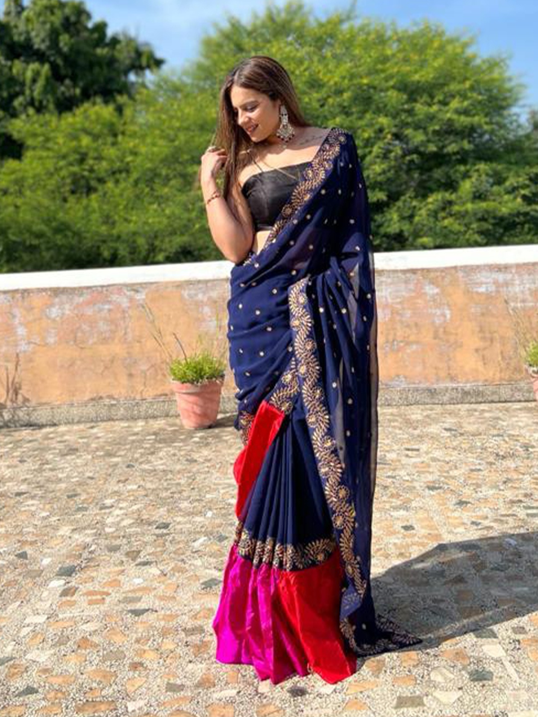 

Inithi Blue Ethnic Motifs Embellished Pure Georgette Saree