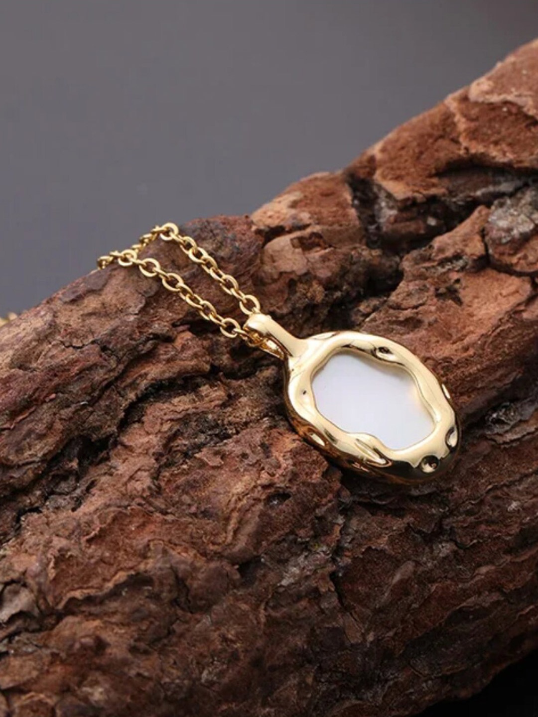 

DressBerry Gold-Toned Gold-Plated Quirky Shaped Stainless Steel Pendant with Chain