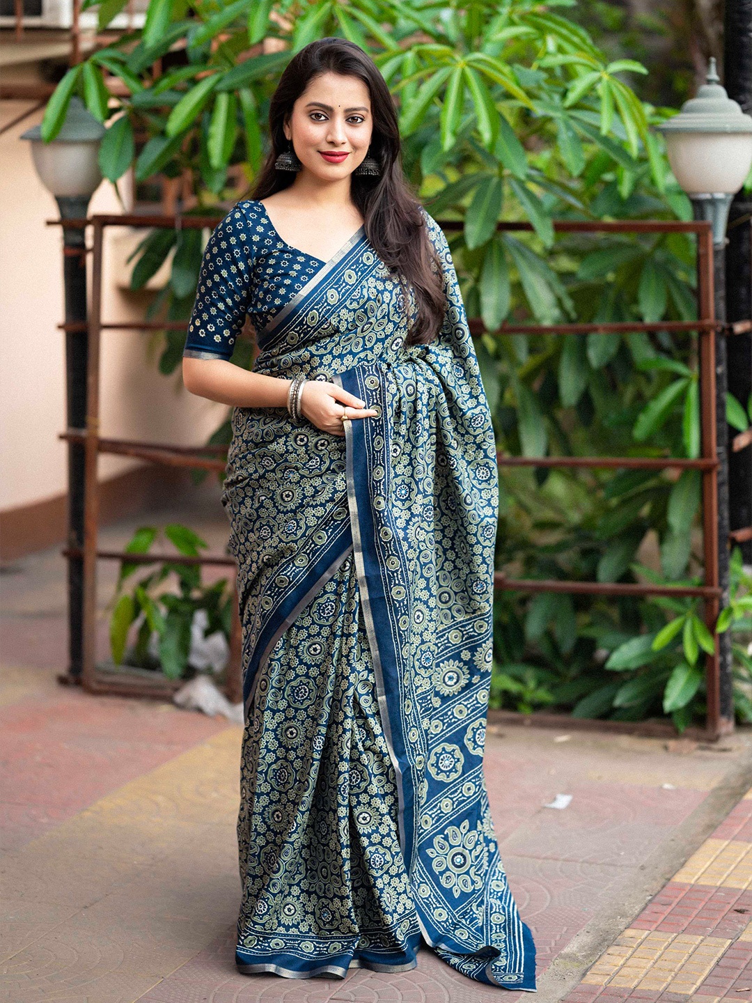 

Mitera Teal Floral Printed Zari Saree