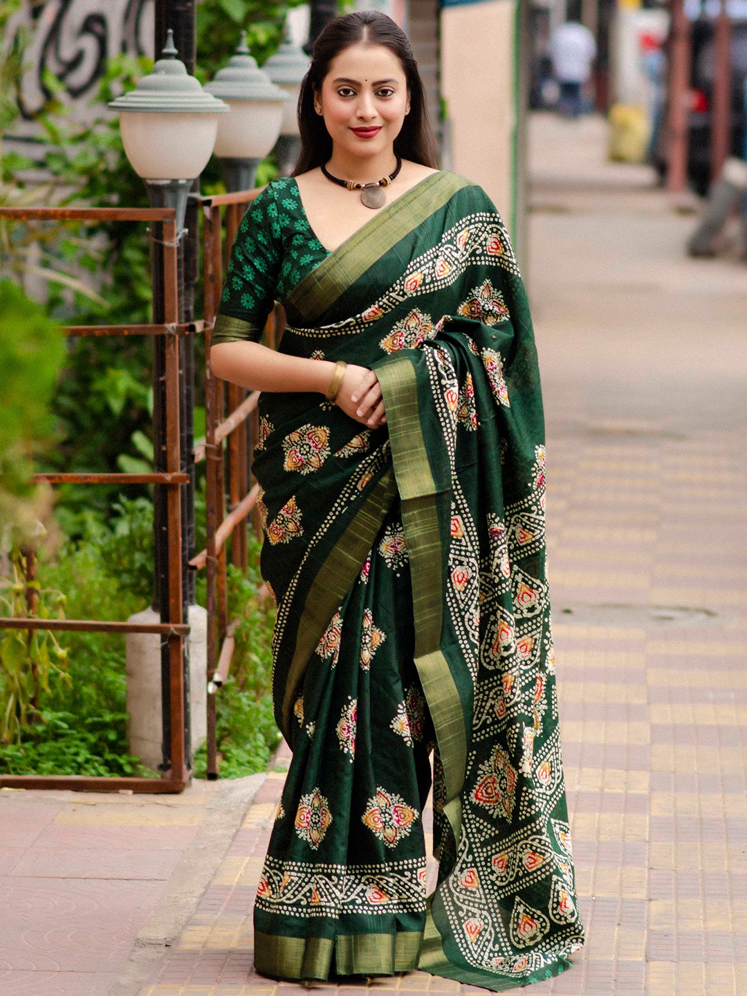 

Mitera Green Bandhani Printed Zari Saree