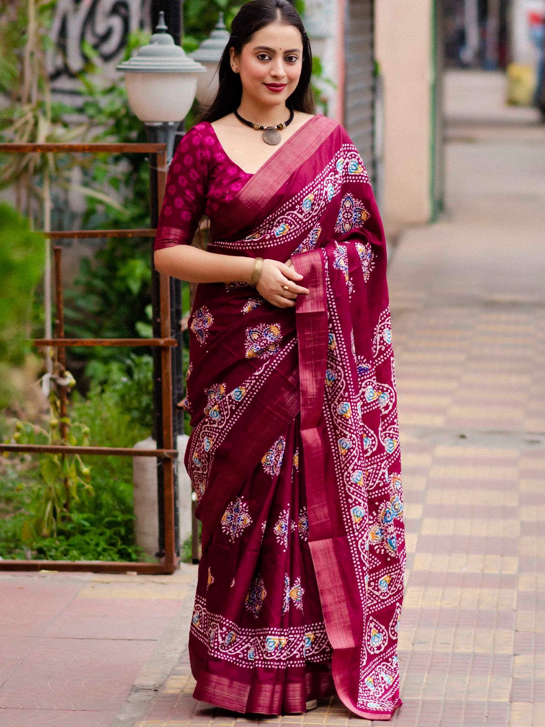 

Mitera Magenta Bandhani Printed Zari Saree