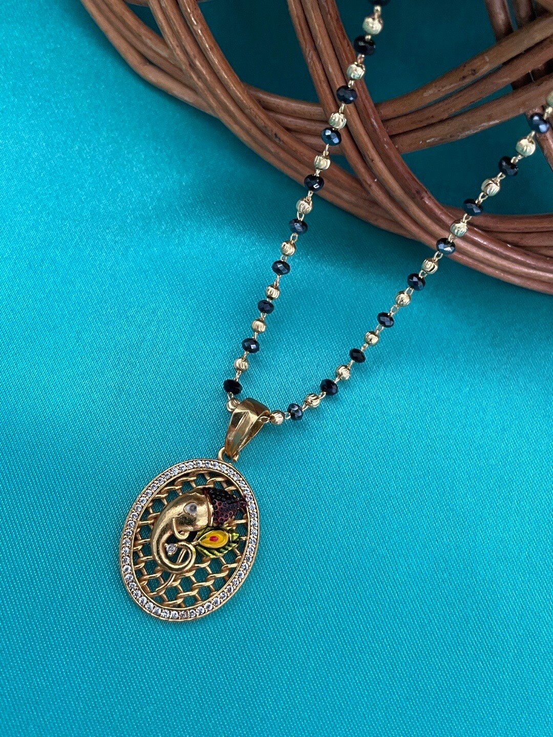 

Digital Dress Room Gold-Plated AD-Studded & Crystal Beaded Ganesha Mangalsutra