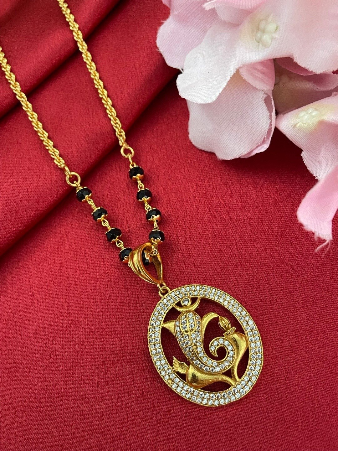 

Digital Dress Room Gold-Plated AD Studded & Beaded Ganesha Pendant Mangalsutra