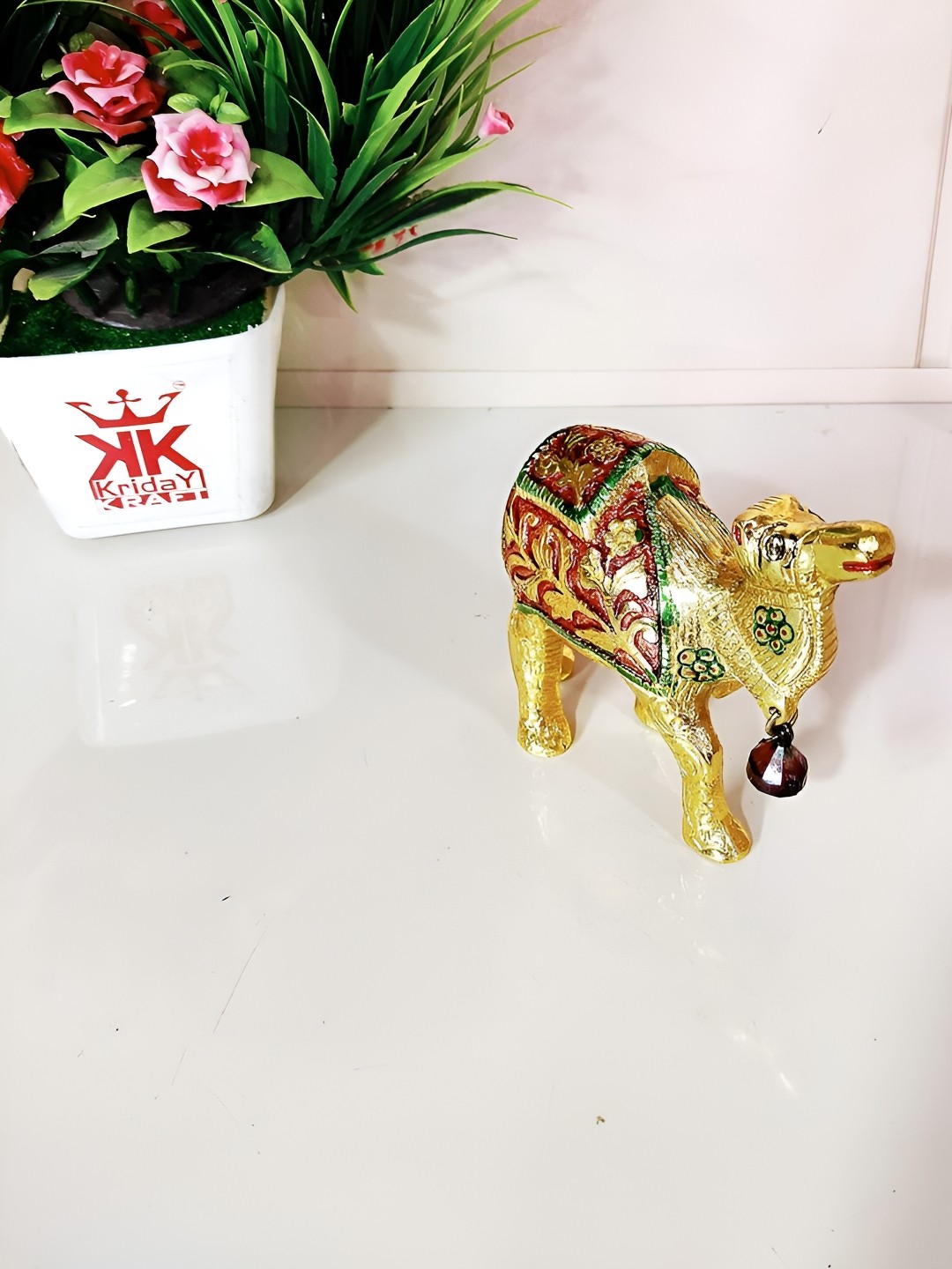 

Kridaykraft Gold-Toned & Red Metal Small Camel Showpiece