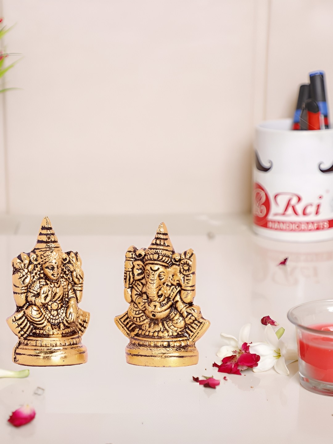 

Kridaykraft Gold-Toned 2 Pieces Metal Small Lord Ganesha Idol Showpieces