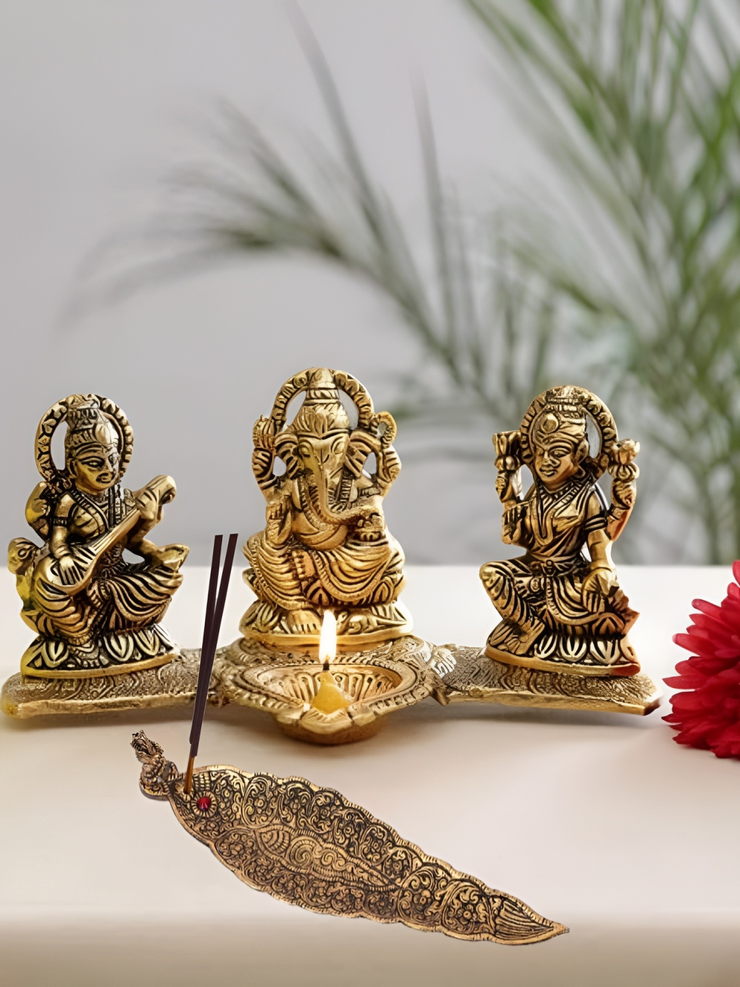 

Kridaykraft Gold-Toned Laxmi Ganesha Saraswati Showpiece