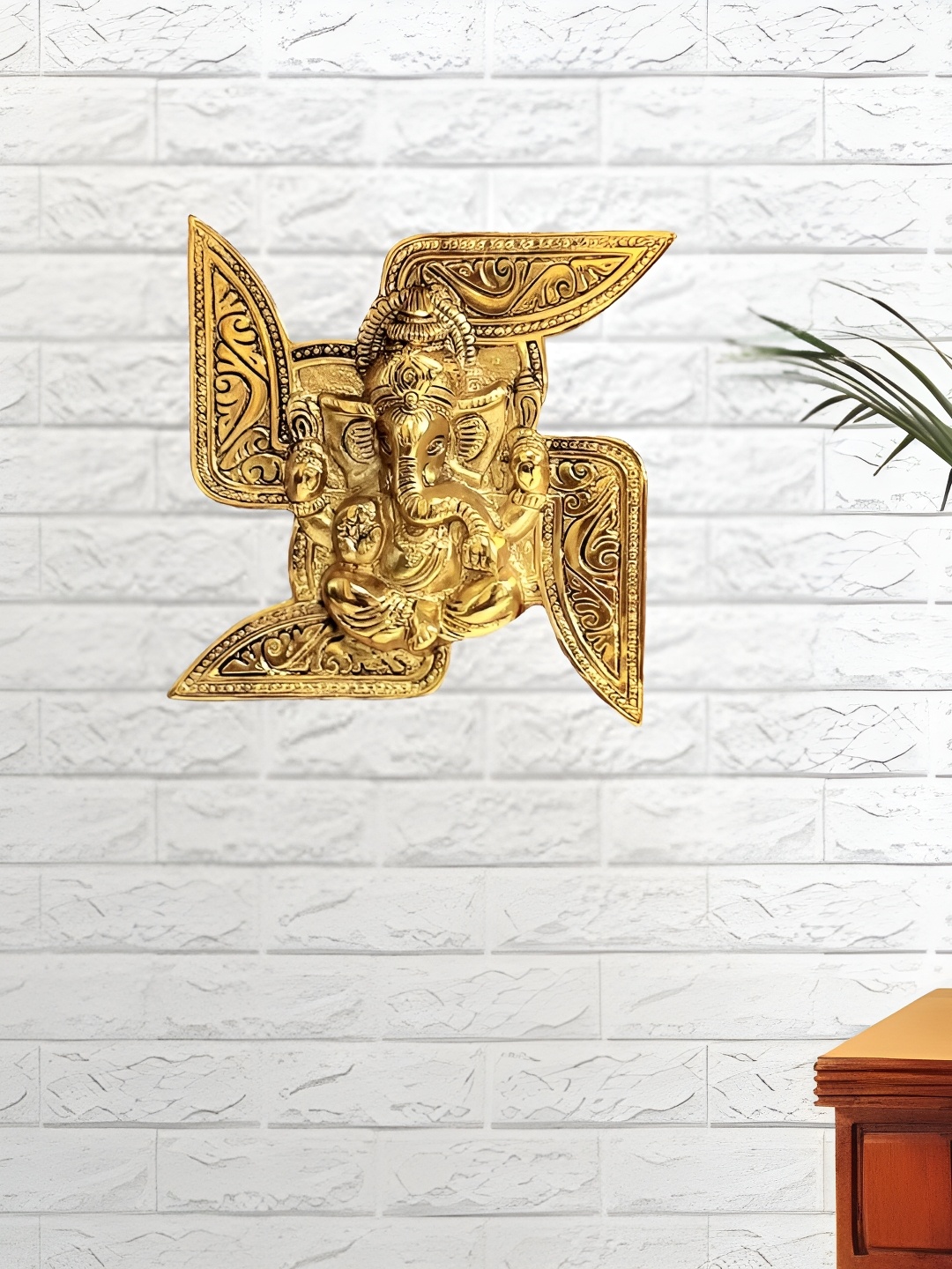 

Kridaykraft Gold Toned Lord Ganesha In Swastik Religious Idol Small Showpiece