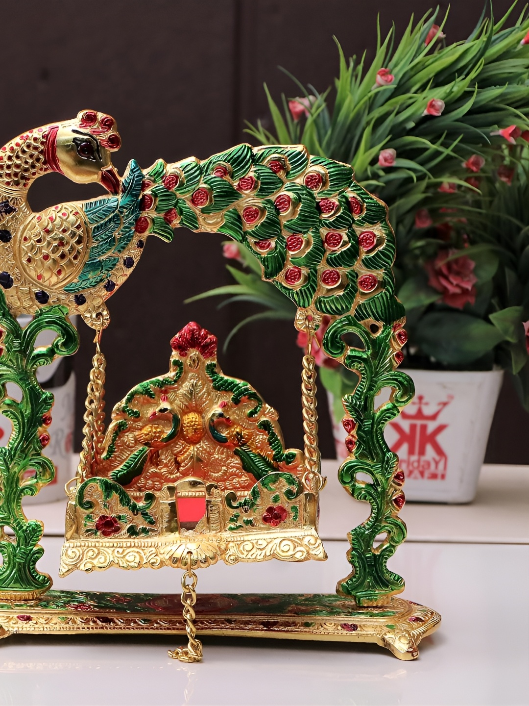 

Kridaykraft Gold-toned & Green Laddu Gopal Jhulla Showpiece