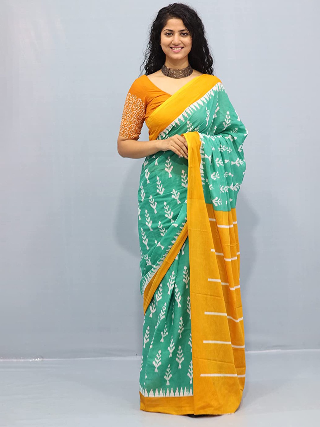 

NIKHILAM Floral Pure Cotton Handloom Ikat Saree, Orange