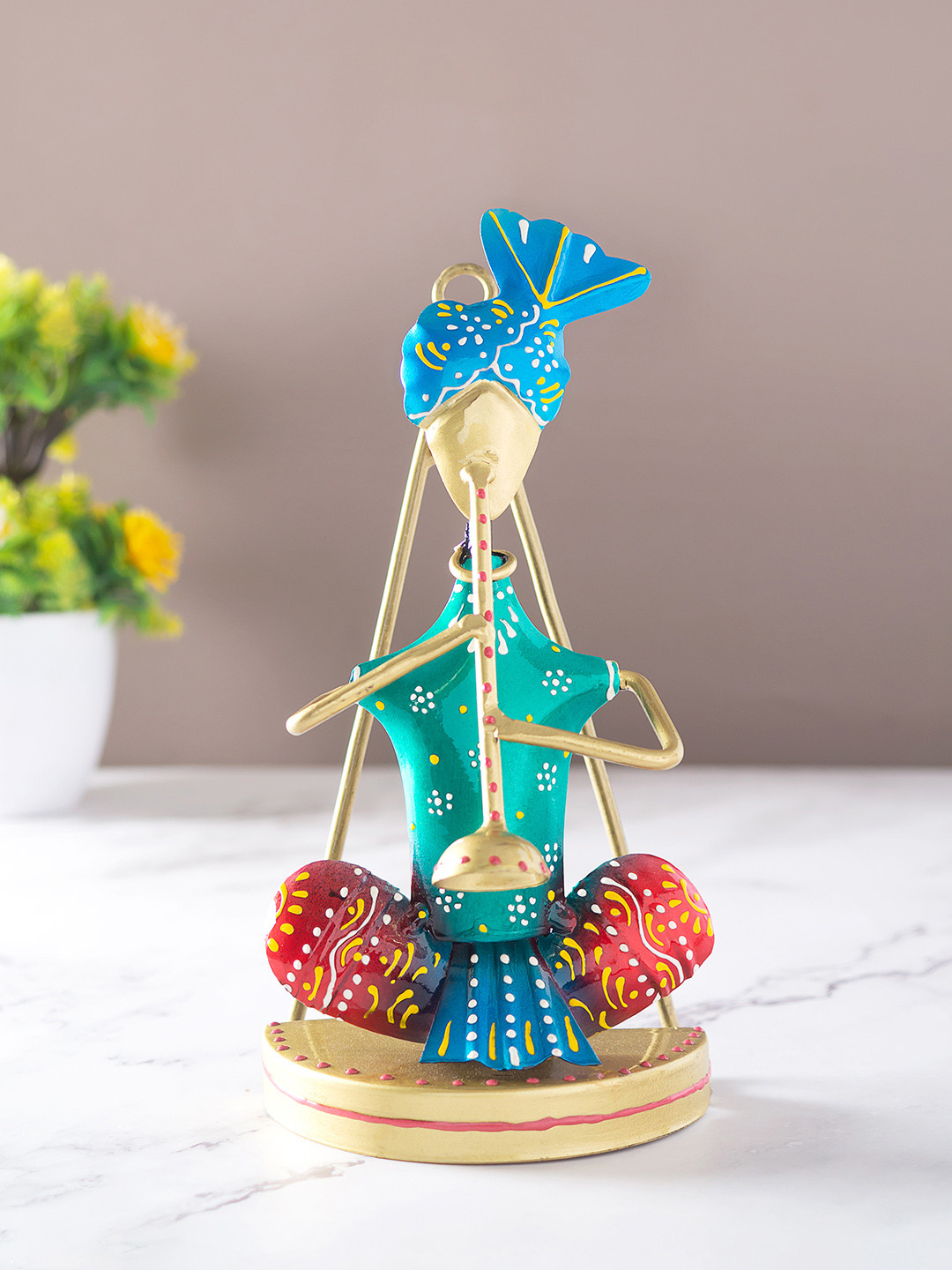 

Golden Peacock Blue and Green Musican Figurine Showpiece