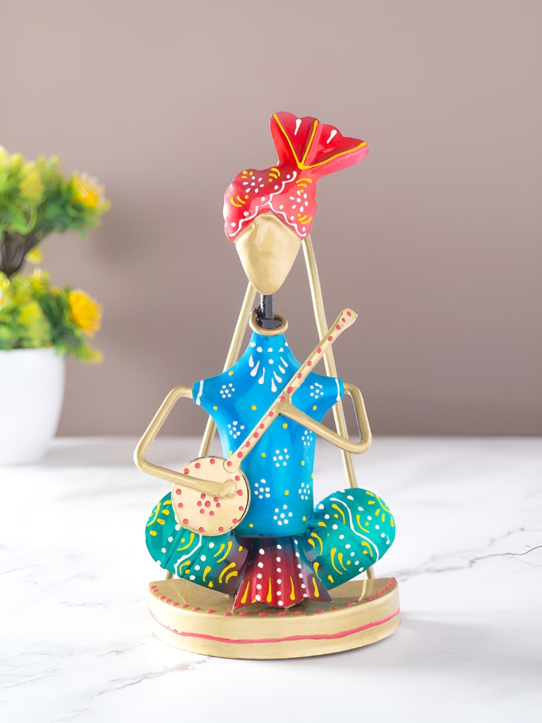 

Golden Peacock Blue and Green Musican Figurine Showpiece