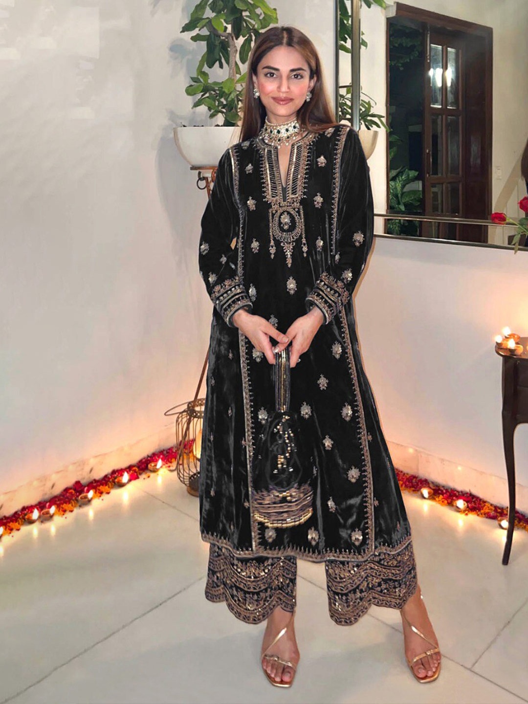 

KALINI Black Embroidered Velvet Unstitched Dress Material