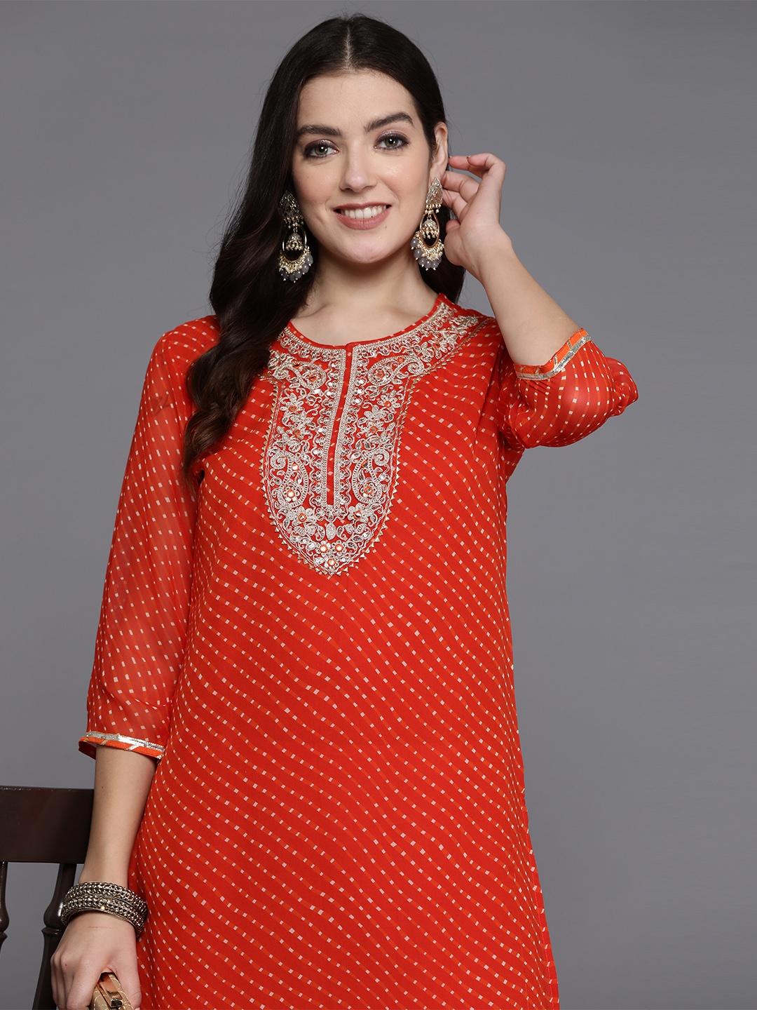 

Indo Era Women Floral Yoke Design Gotta Patti Georgette Kurta, Orange