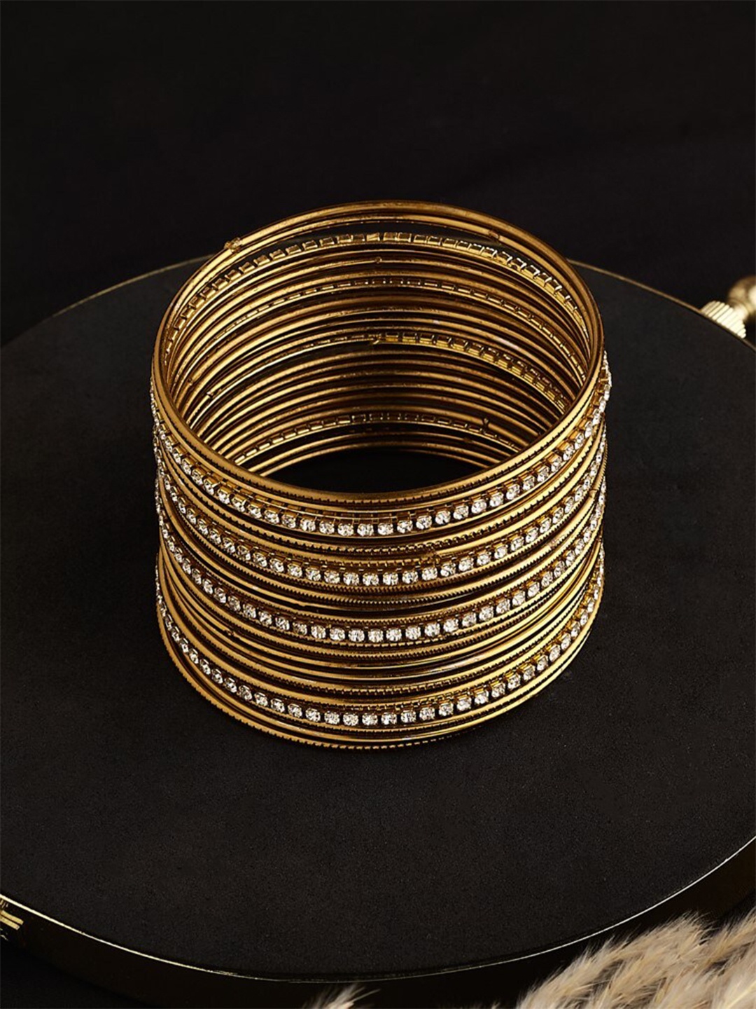 

ATIBELLE Set Of 22 Gold Plated AD Stone Studded Bangles