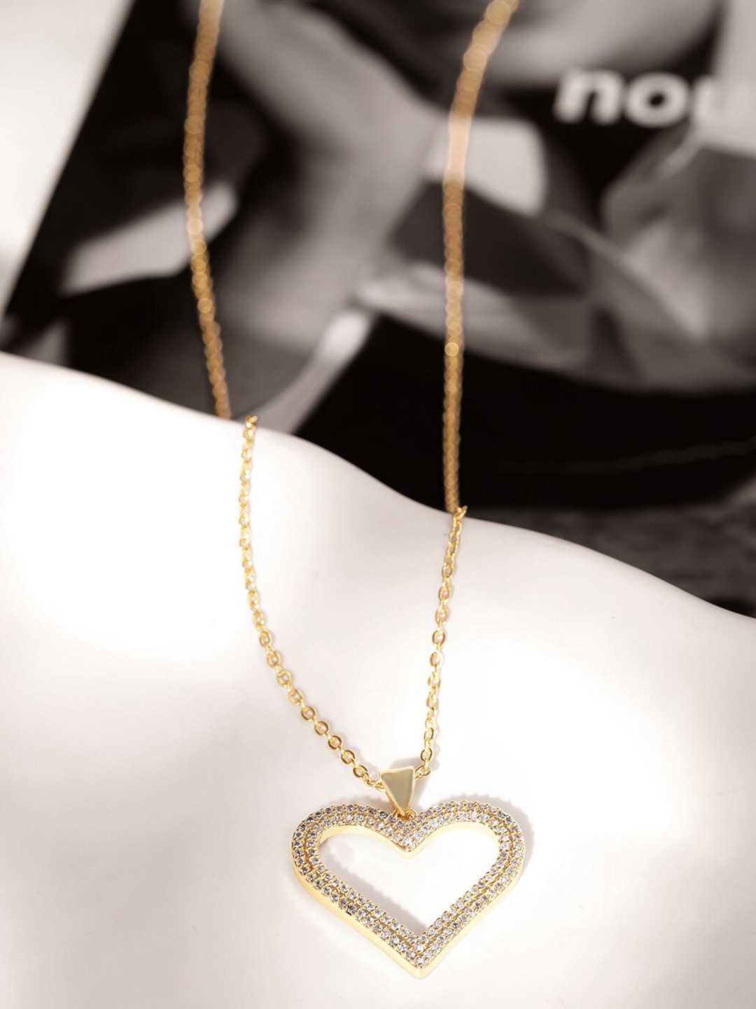 

The Roadster Lifestyle Co. Gold Plated Stone Studded Demi-Fine Heart Pendant With Chain