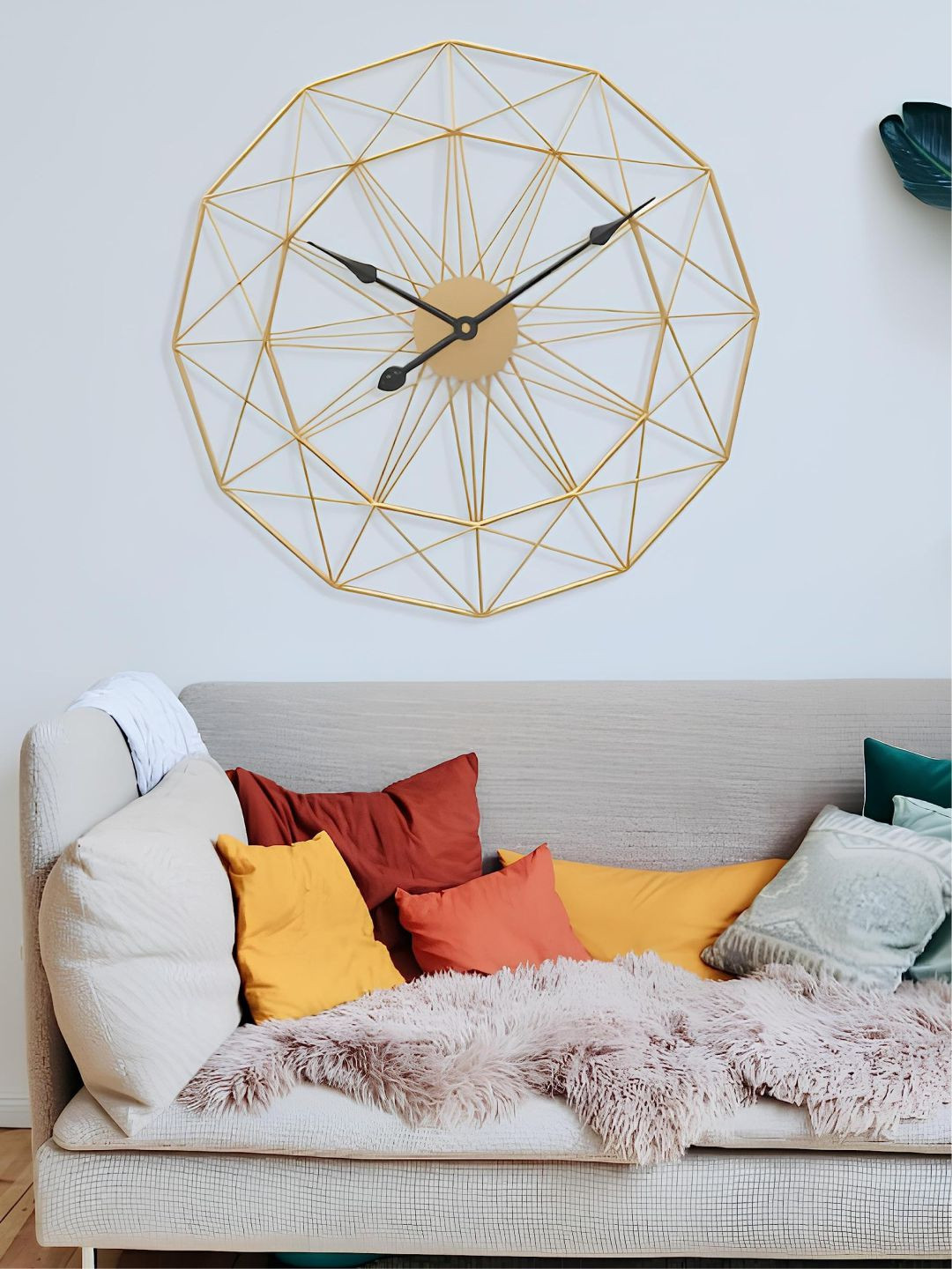 

The Art House Gold Toned & Black Textured Metal Abstract Shaped Wall Clock