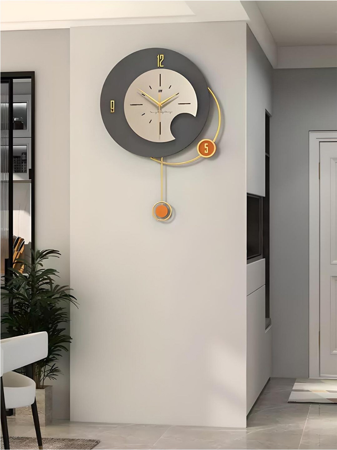 

The Art House Gold Toned & Grey Metal Abstract Shaped Wall Clock