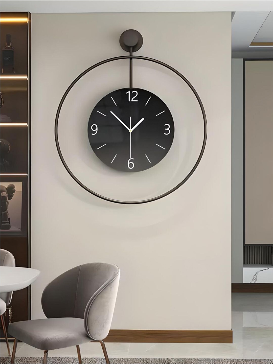 

The Art House Black Round Shaped Metal Wall Clock