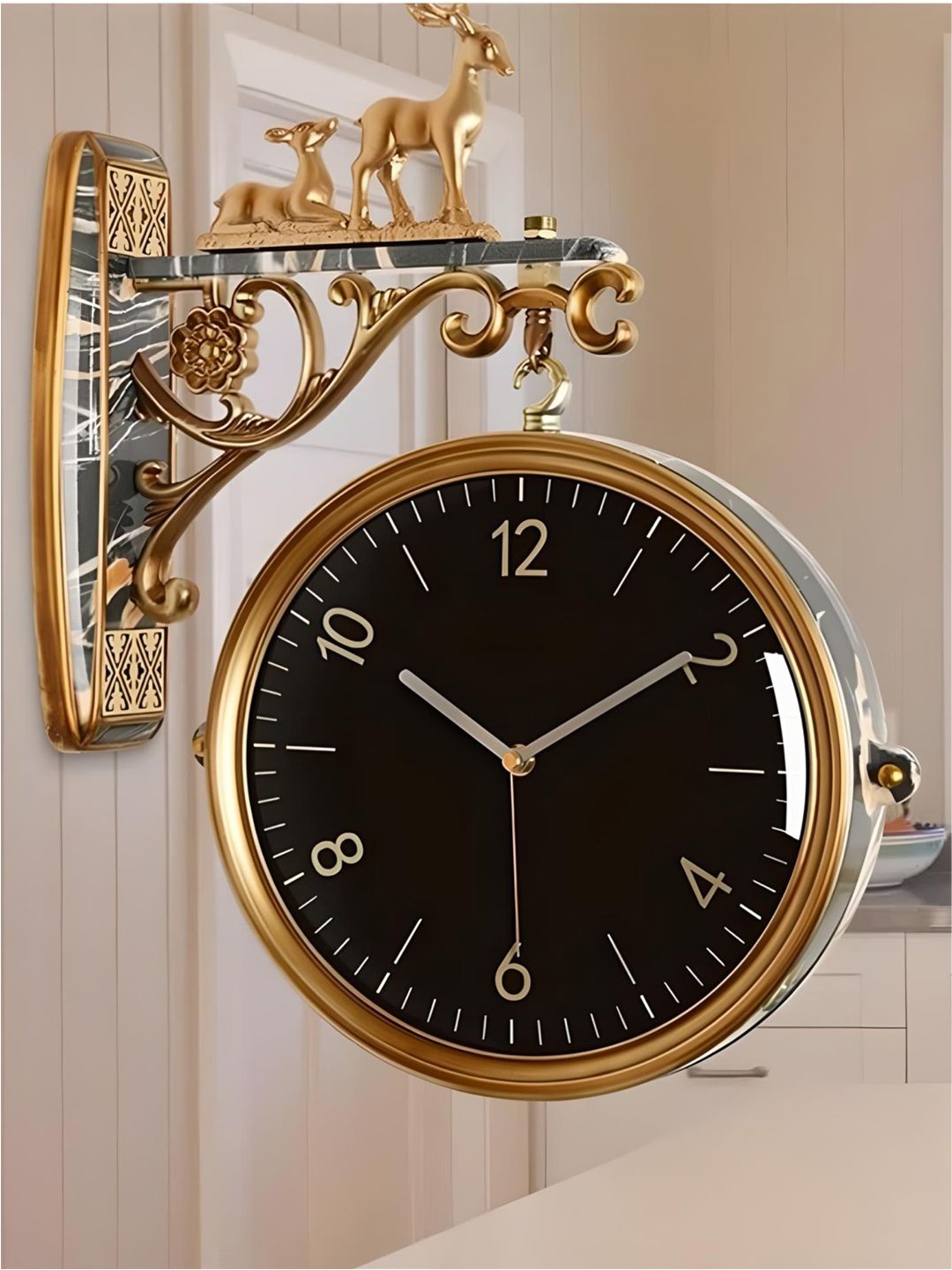 

The Art House Gold Toned & Black Round Shaped Metal Wall Clock