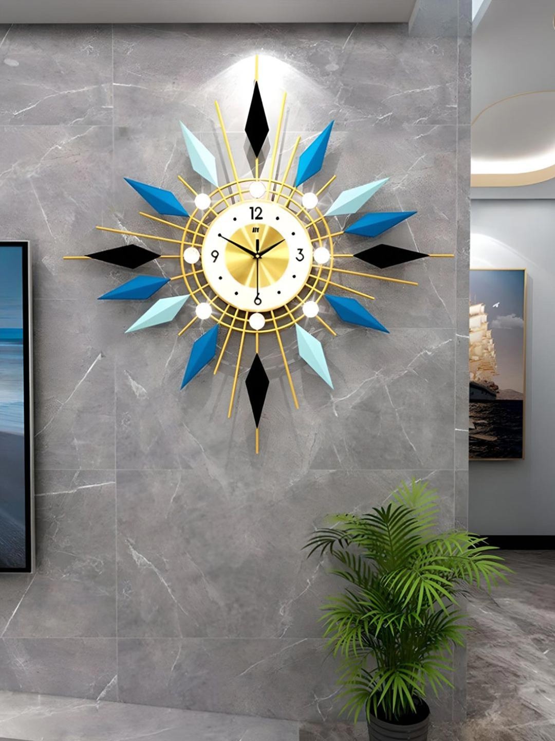 

The Art House Gold Toned & Blue Abstract Shaped Metal Wall Clock