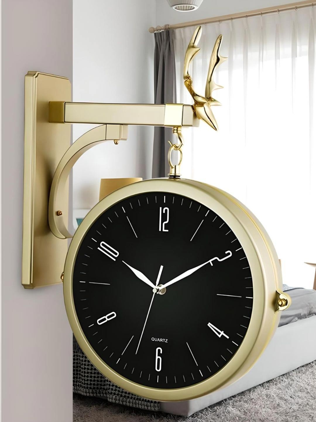 

The Art House Gold Toned & Black Round Shaped Metal Wall Clock