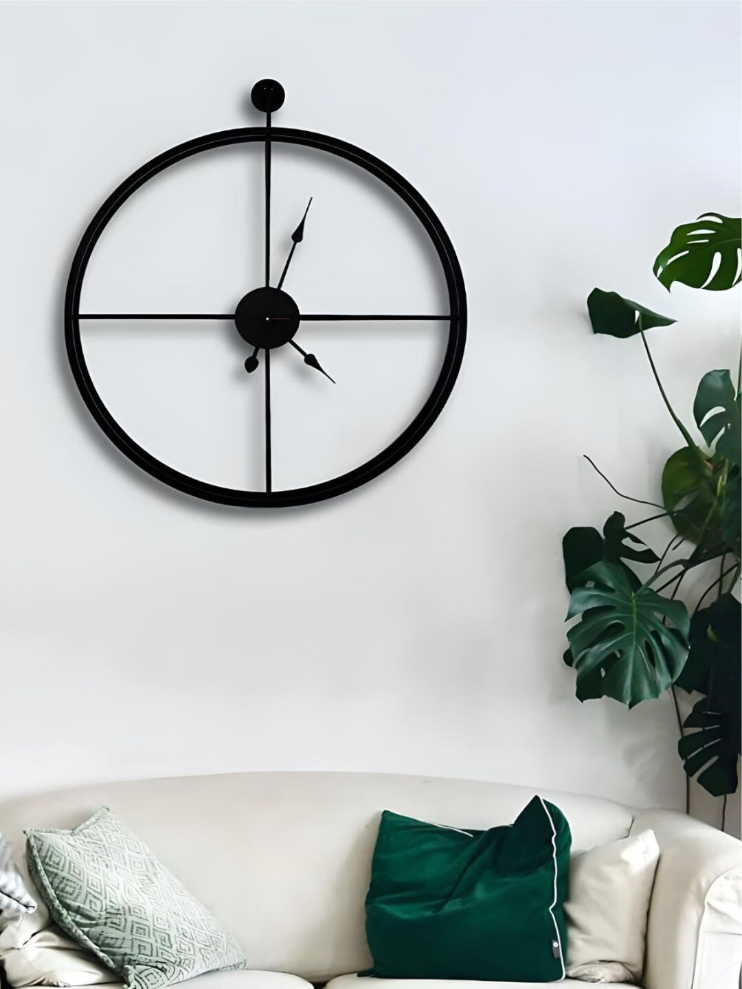 

The Art House Black Round Shaped Metal Wall Clock