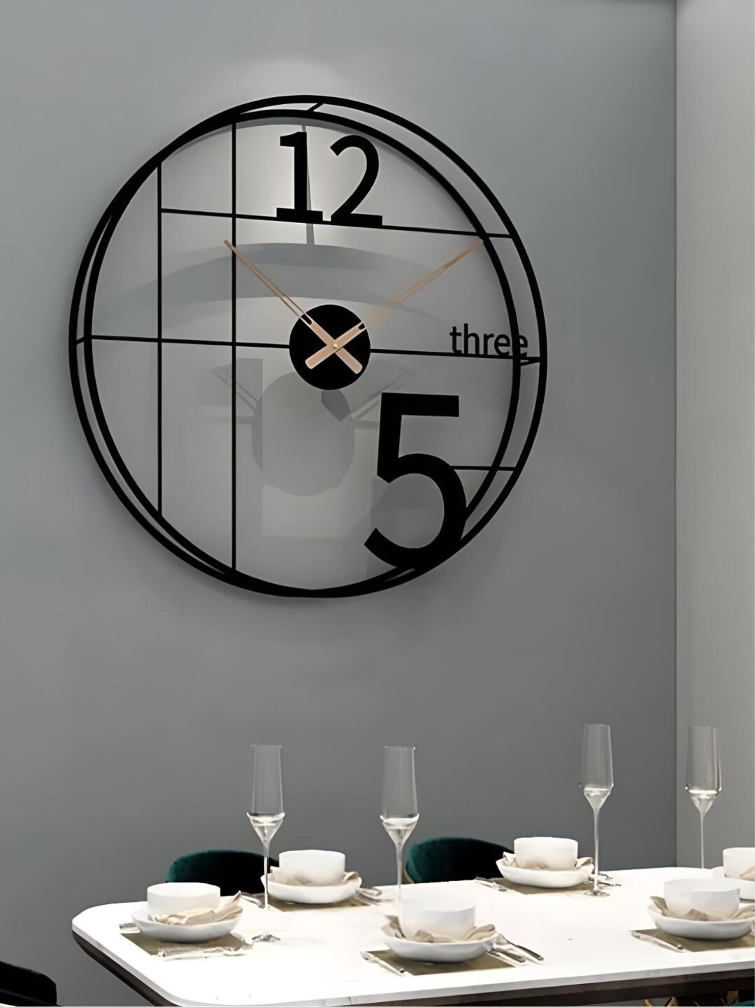 

The Art House Black Round Shaped Metal Wall Clock