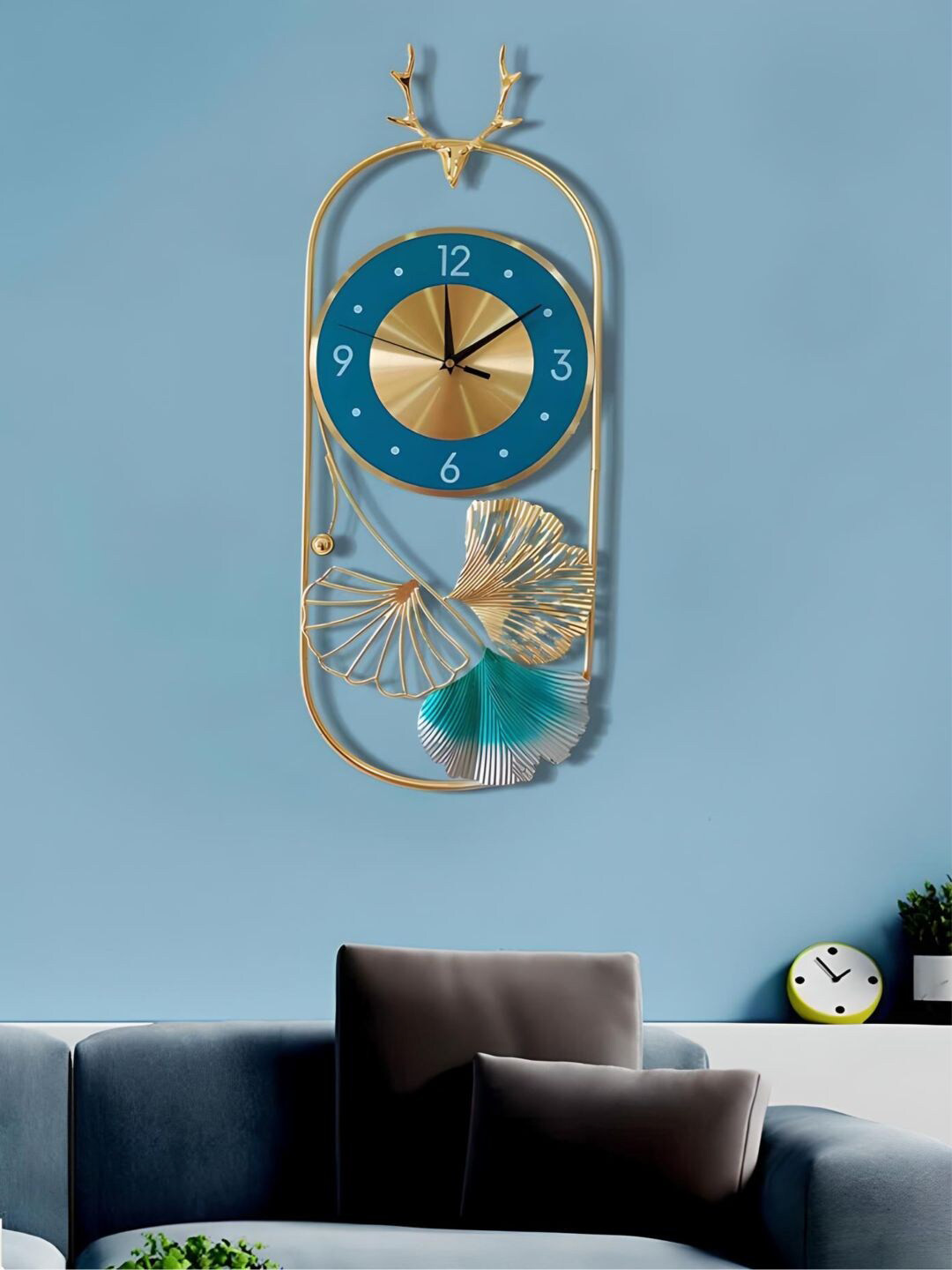 

The Art House Gold-Toned & Blue Oval Shaped Metal Wall Clock