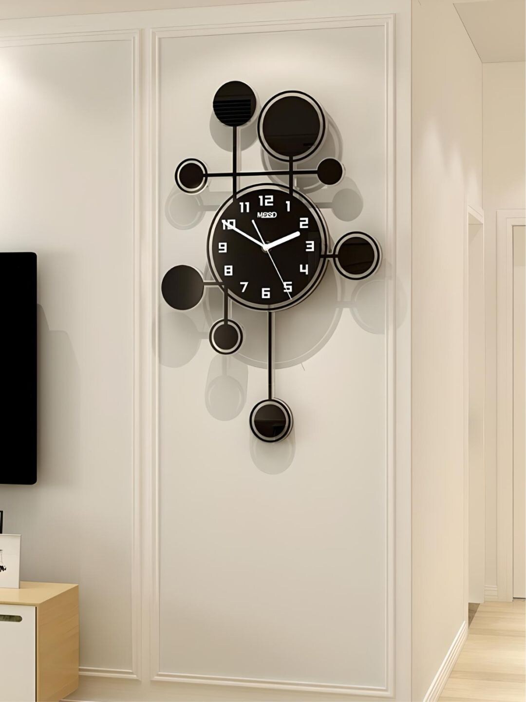 

The Art House Black Round Shaped Metal Wall Clock