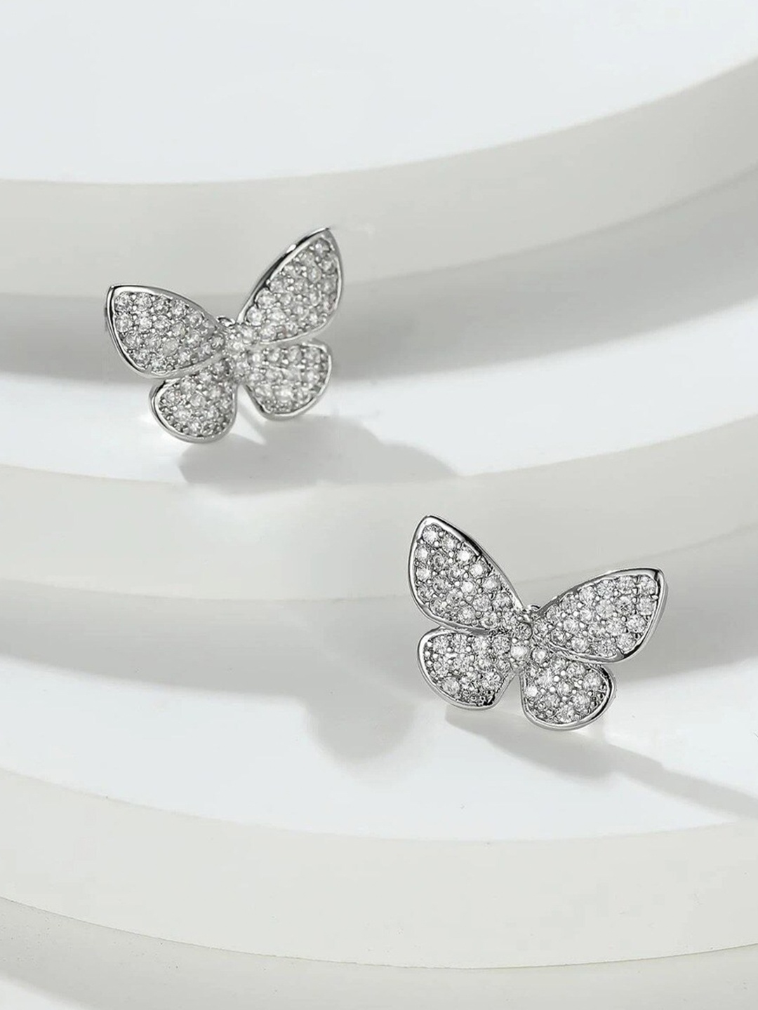 

FIMBUL Platinum Plated CZ Stone-Studded Butterfly Shaped Studs Earrings, Silver