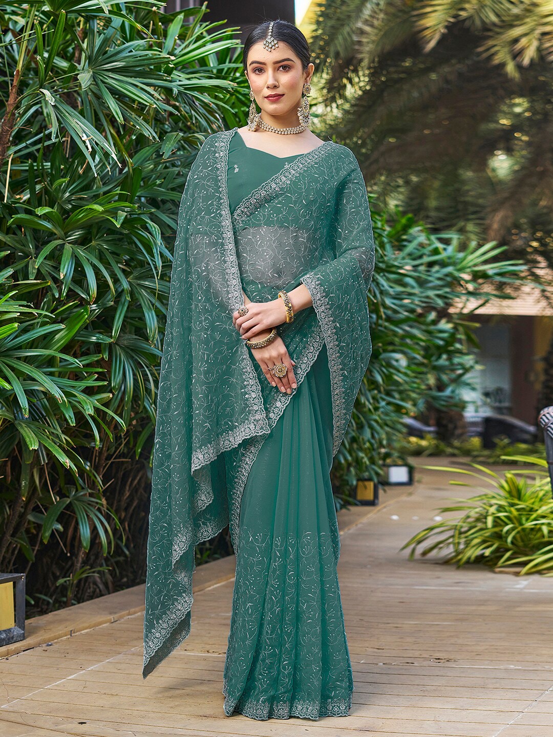 

Mitera Teal Ethnic Motifs Zari Embroidered Saree