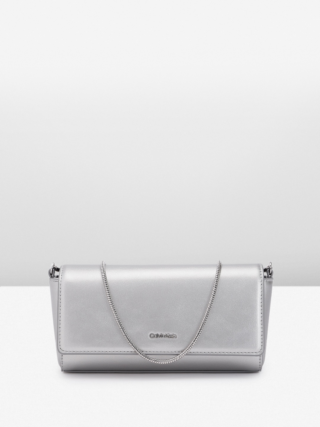 

Calvin Klein Women Solid Sling Bag, Silver